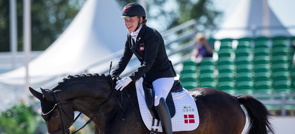 Katrine Kristensen og Gørklintgaards Quater var med en bedømmelse på flotte 77,176% med til at sikre Danmark en sølvmedalje i holdkonkurrencen ved VM i Herning. Foto: FEI/Richard Juilliart.